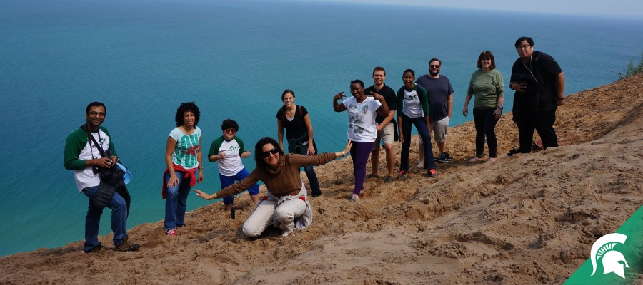 Group of students visiting coastal dunes during MSU GEO Camp 
