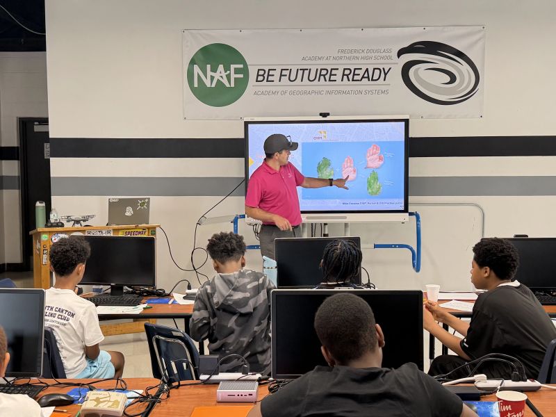 Mike Cousins presenting GIS concepts to students of the Frederick Douglass Academy for Young Men, a tuition-free college preparatory high school in Detroit, Michigan with a history of promoting science, technology, engineering, and mathematics (STEM) programs.