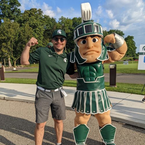 Mike Cousins posing with Sparty