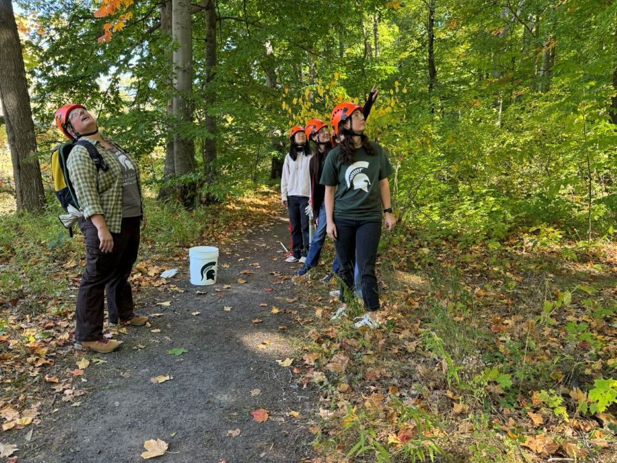 Dr. Kyla Dahlin and students conducting research on the campus of Michigan State University.