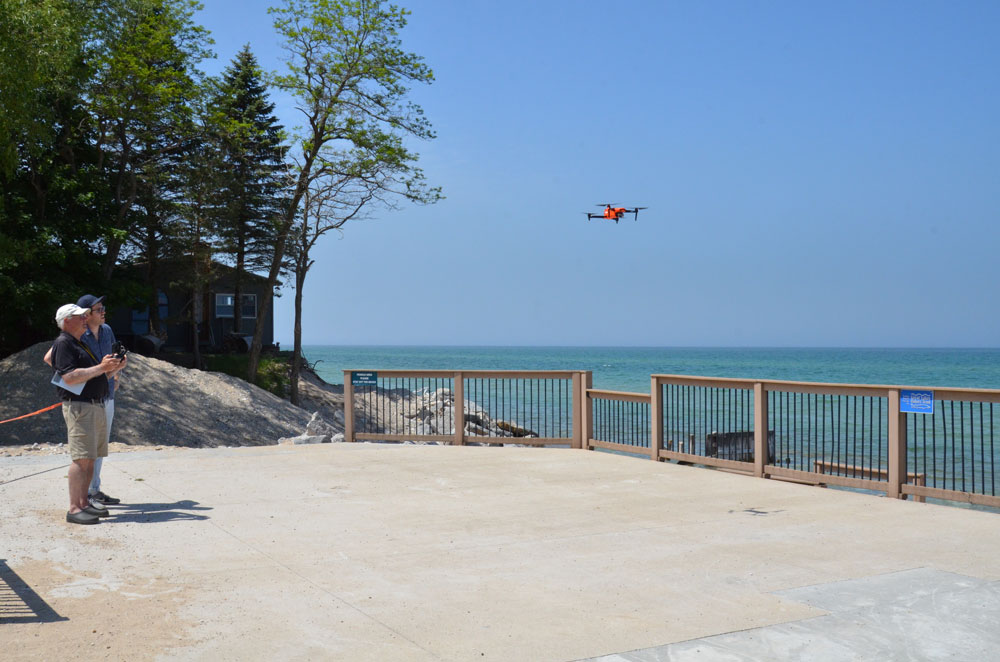 Lucas Rabins and Citizen Scientist Dan Laskey using drones to monitor coastal erosion along Lake Michigan. 