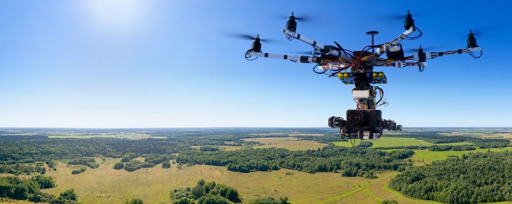 Drone flying over field