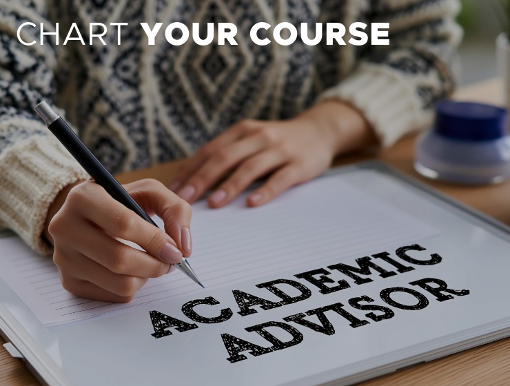 Person wearing colorful sweater pointing to whiteboard with text of Academic Advisor